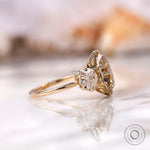 Side profile of pear old mine cut moissanite ring