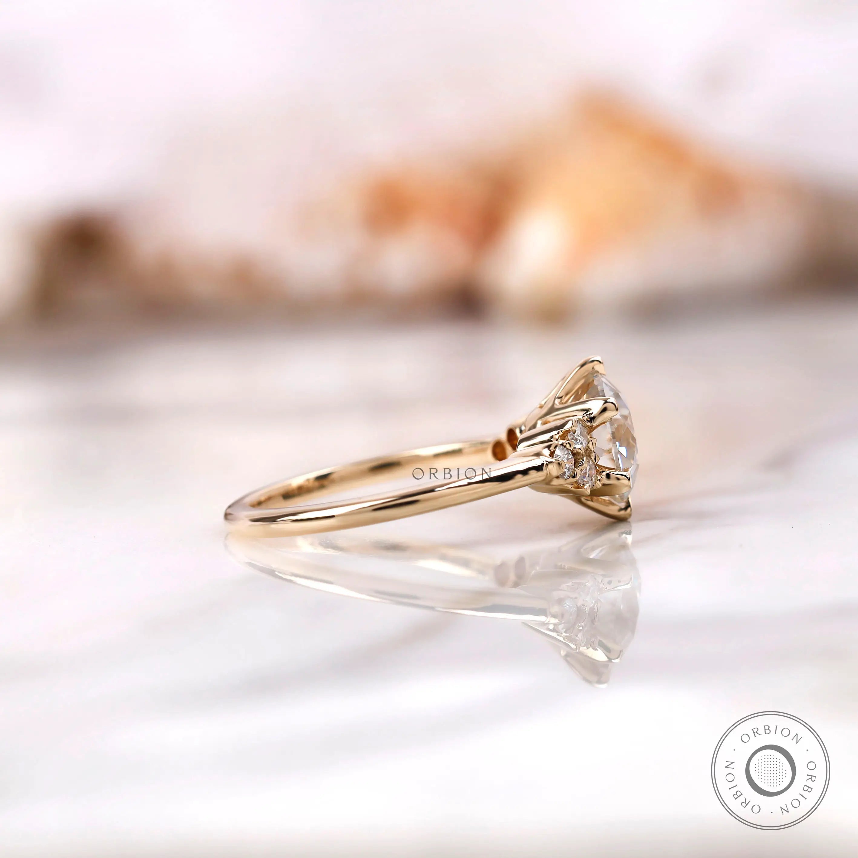 Side profile of OEC Moissanite engagement ring with diamond accents.