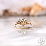 Back view of OEC Moissanite engagement ring with detailed prong setting.