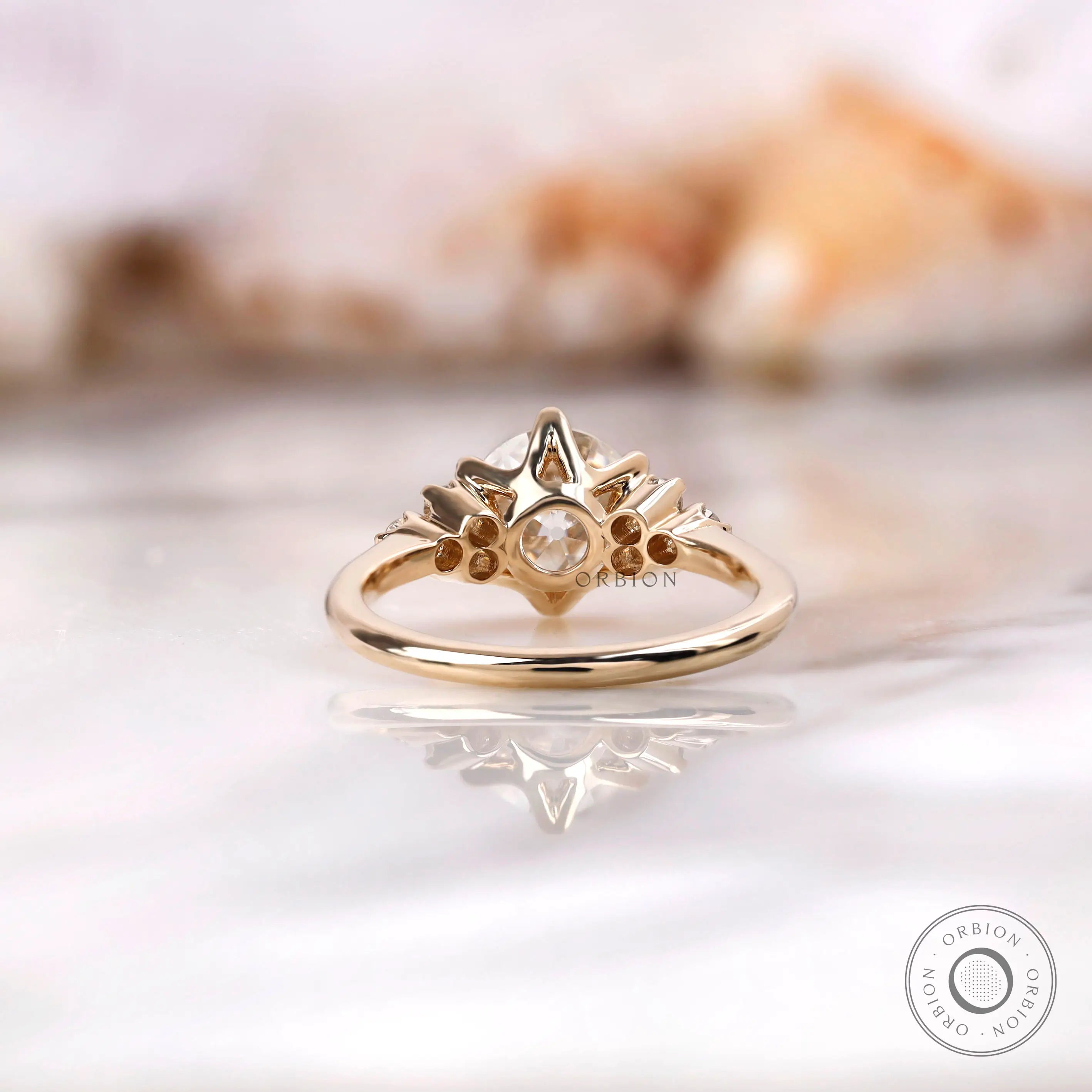 Back view of OEC Moissanite engagement ring with detailed prong setting.