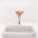 Side profile view cluster ring on soft white box