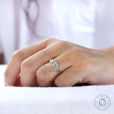 OEC Moissanite cluster engagement ring shown on a model's finger