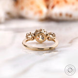 Back view of yellow gold three stone engagement ring structure