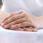 Cushion cut moissanite ring worn on hand lifestyle view