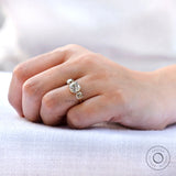 Antique inspired three stone moissanite ring finger shot
