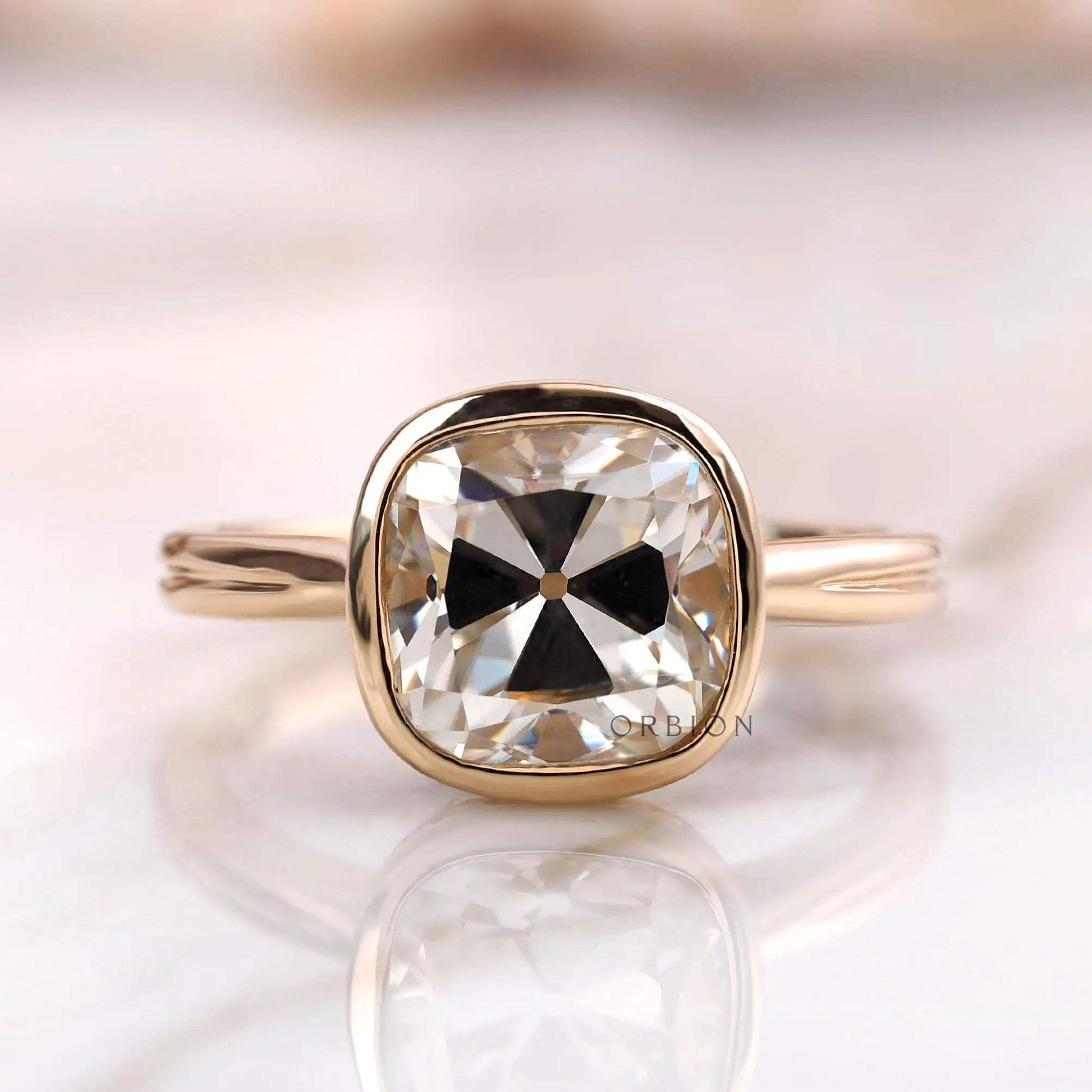 Cushion Old Mine Cut moissanite solitaire bezel ring front view