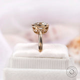 Vertical side view of cushion moissanite bezel solitaire ring