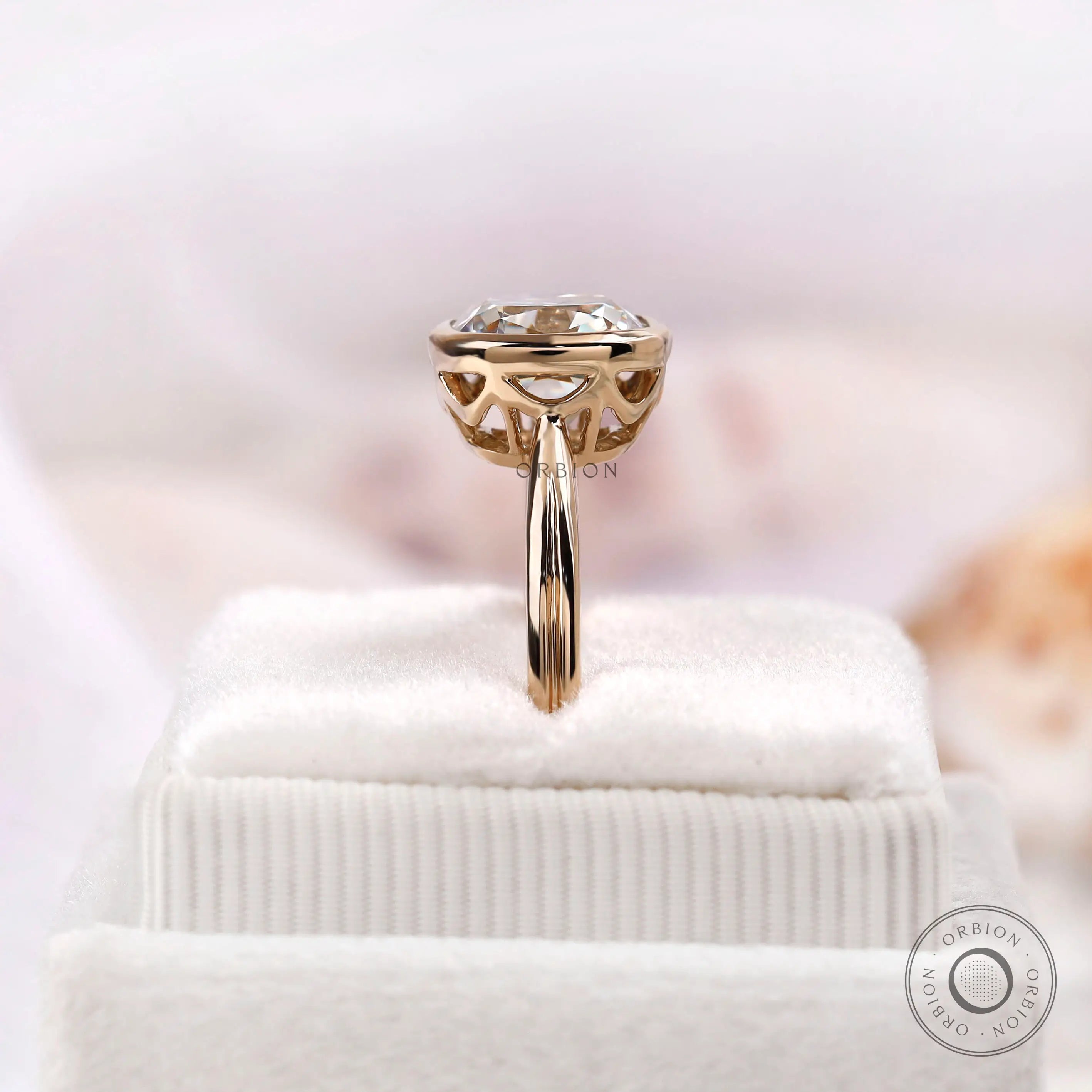Vertical side view of cushion moissanite bezel solitaire ring