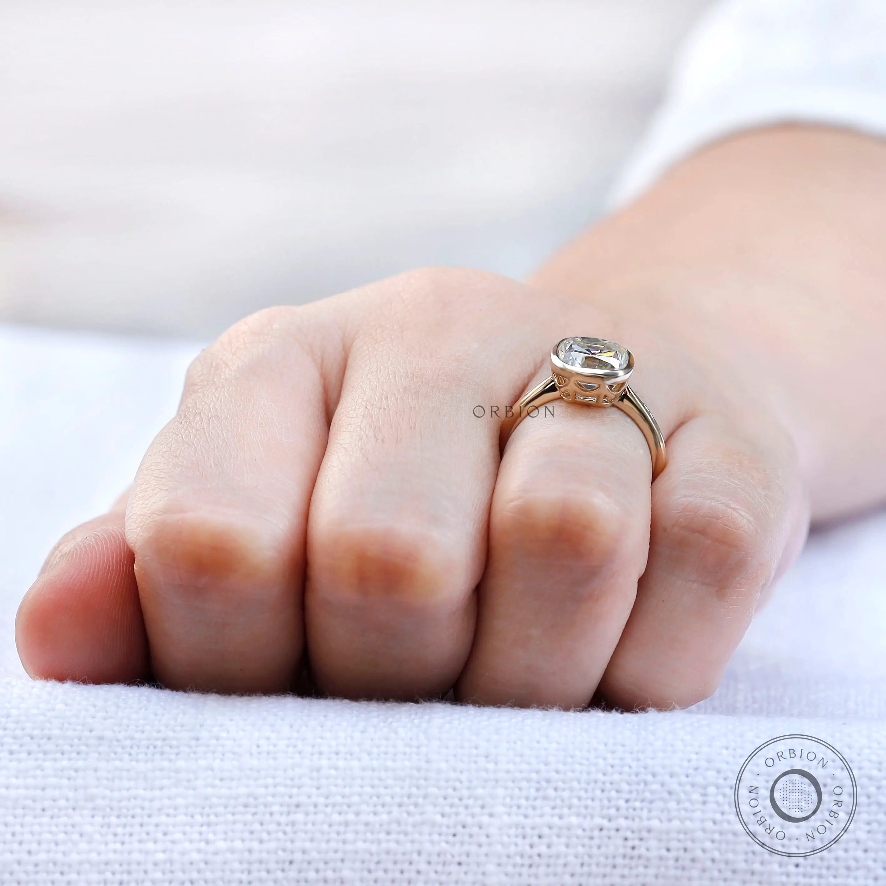 Hand worn cushion Old Mine Cut moissanite bezel solitaire ring