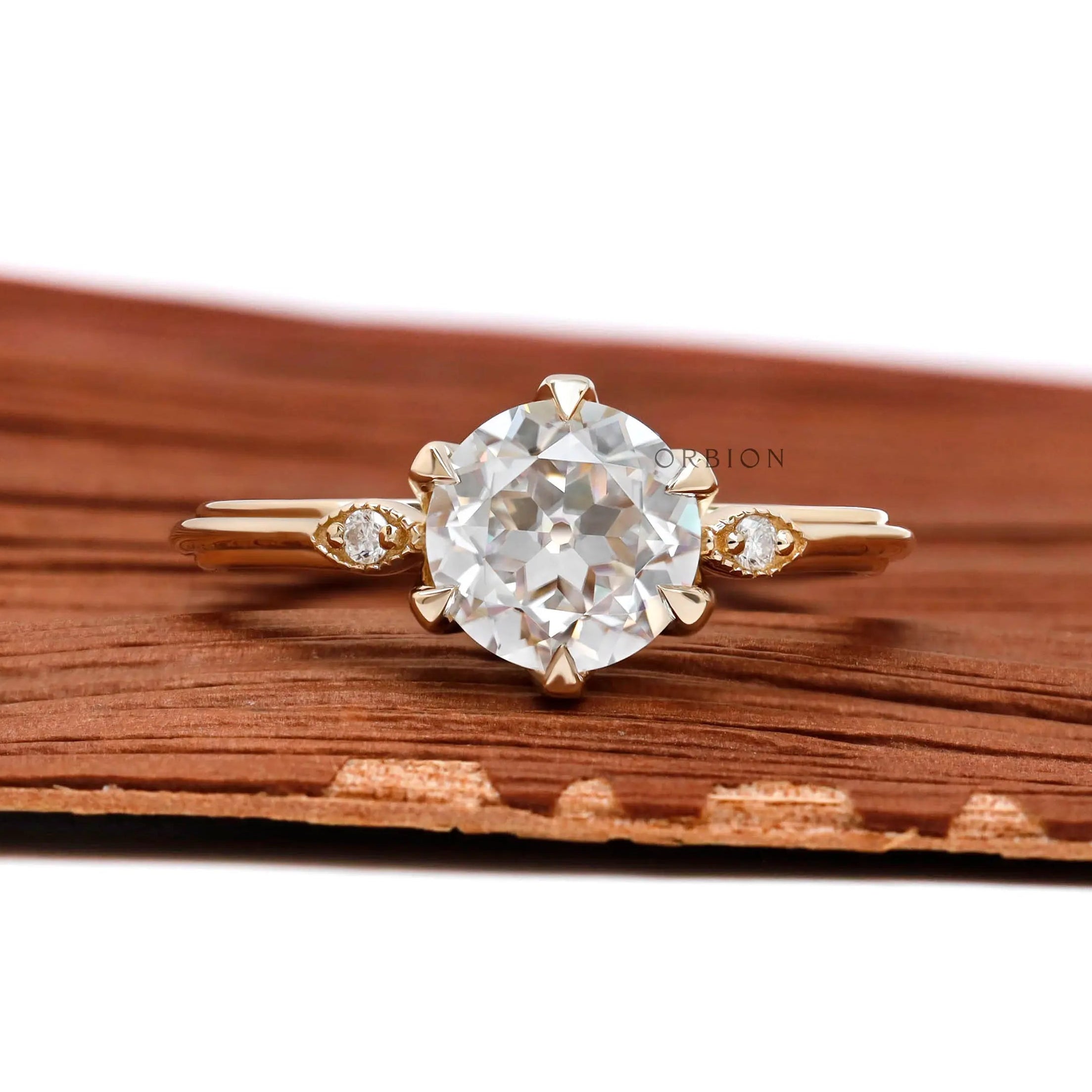 Three stone round Old European cut moissanite engagement ring