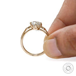 Round moissanite three stone ring with round accents