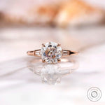Front view of round Old European Cut moissanite ring with baguette side stones