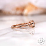 Side profile of Old European Cut moissanite three stone ring in 10K rose gold