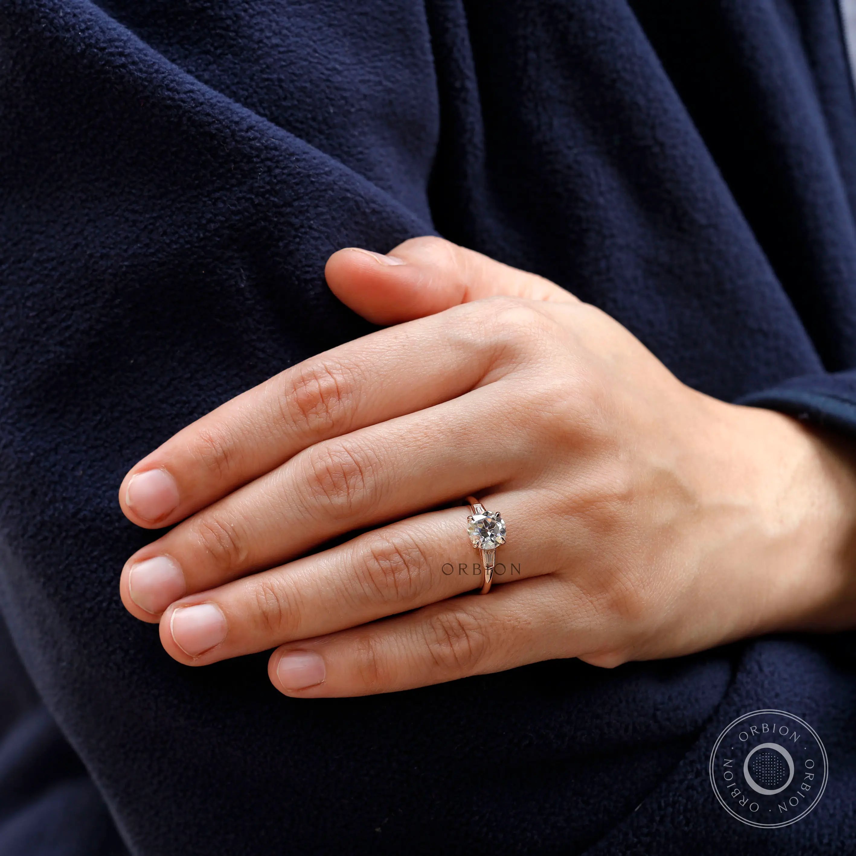 Lifestyle on-hand view of rose gold Old European Cut moissanite ring