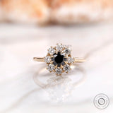 Front view black moissanite halo cluster ring in yellow gold