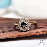 Round Old European Cut black moissanite halo ring in yellow gold front view