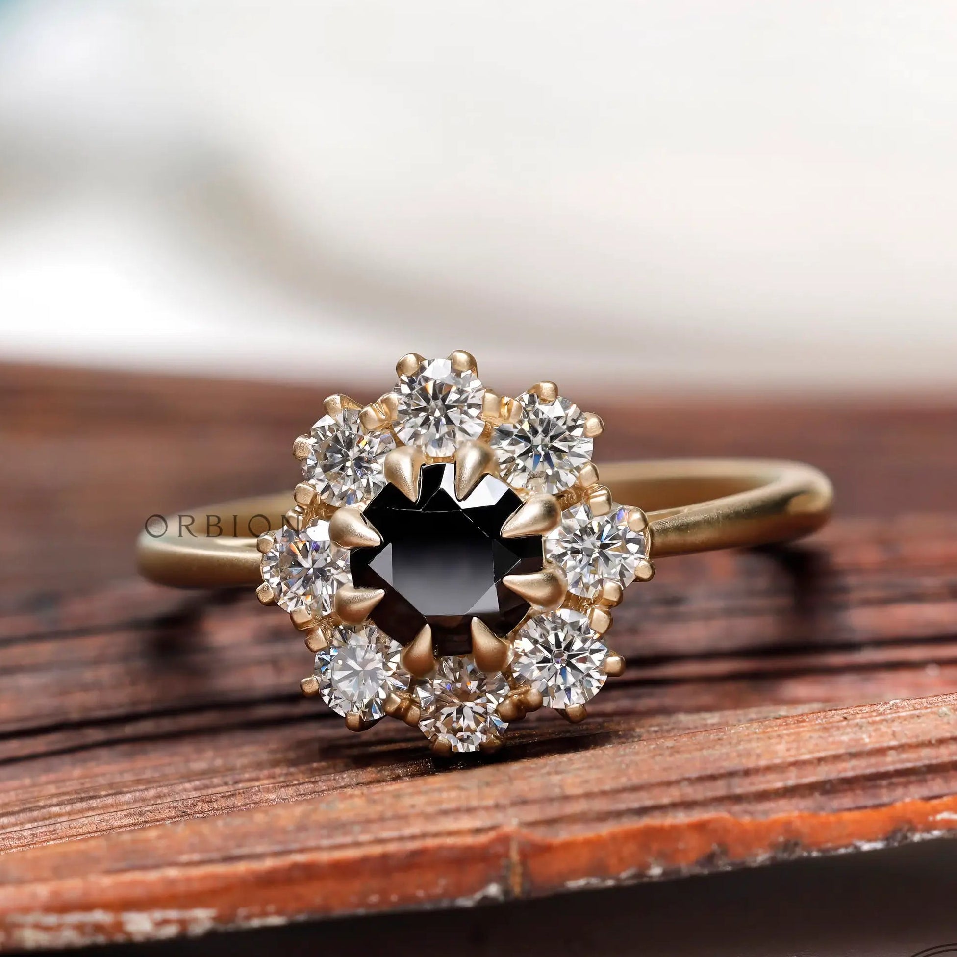 Round Old European Cut black moissanite halo ring in yellow gold front view