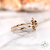Side view halo cluster setting with black moissanite center