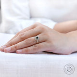Top view on hand black moissanite halo cluster ring