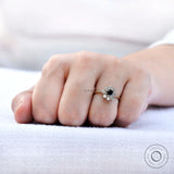 Close-up on-hand view black moissanite halo sparkle