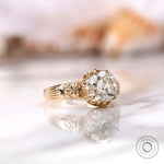 Close view of round moissanite antique style ring with crown setting