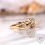 Side profile of vintage inspired round moissanite engagement ring in yellow gold