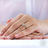 Elegant vintage inspired moissanite engagement ring worn on hand