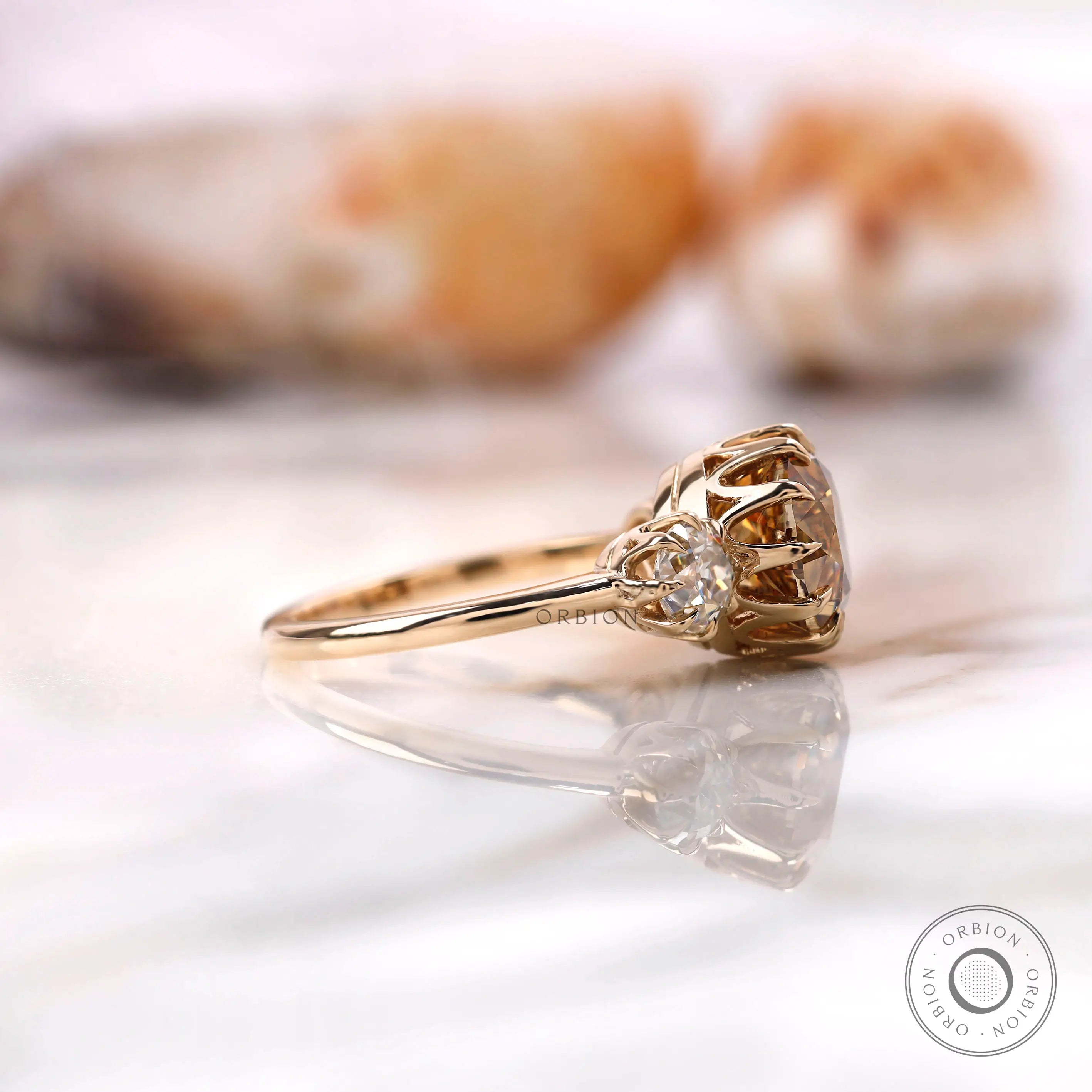 Antique inspired three stone moissanite ring with crown prong setting