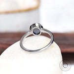 Back view of white gold solitaire ring with slim band