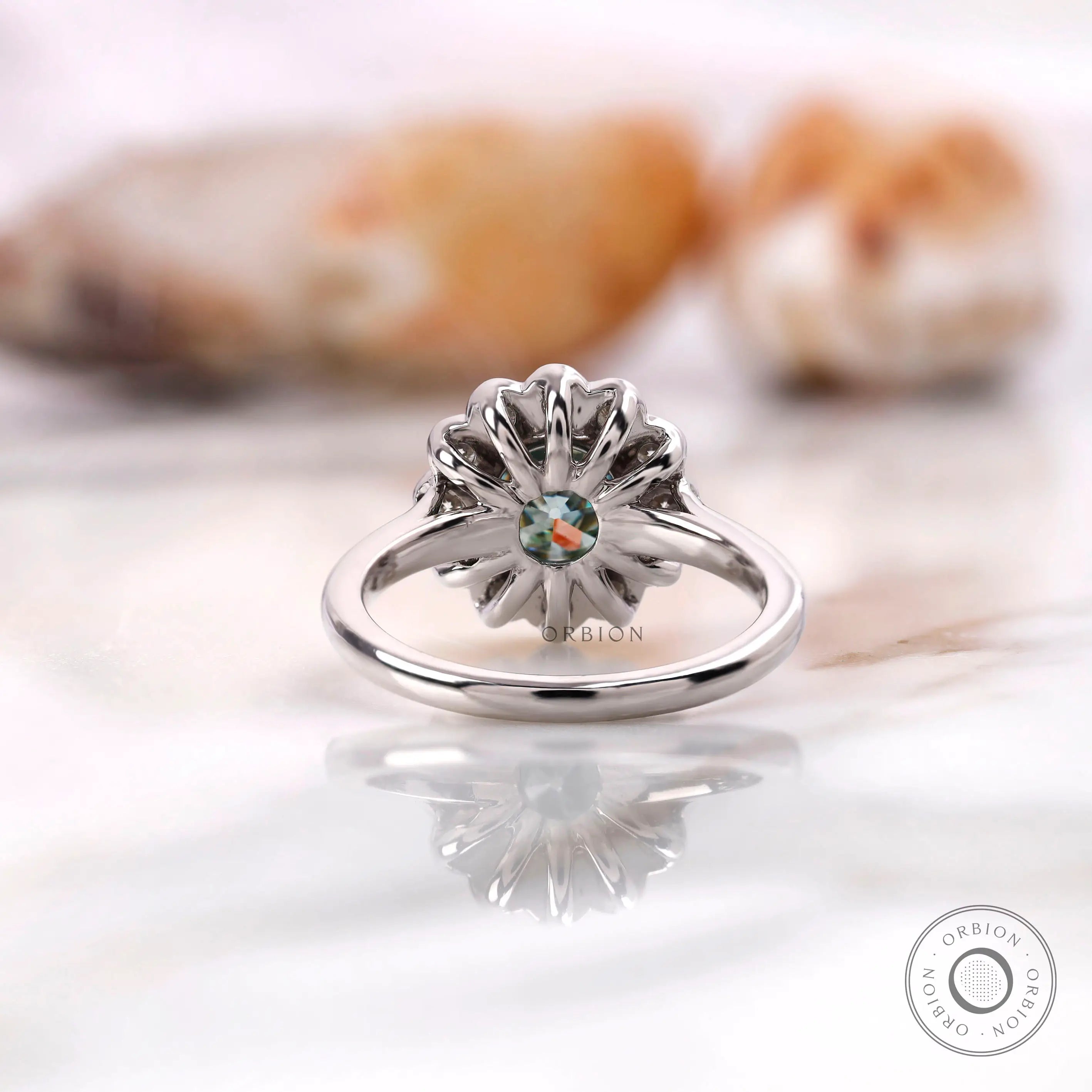 Round Old European cut center with cluster halo detail