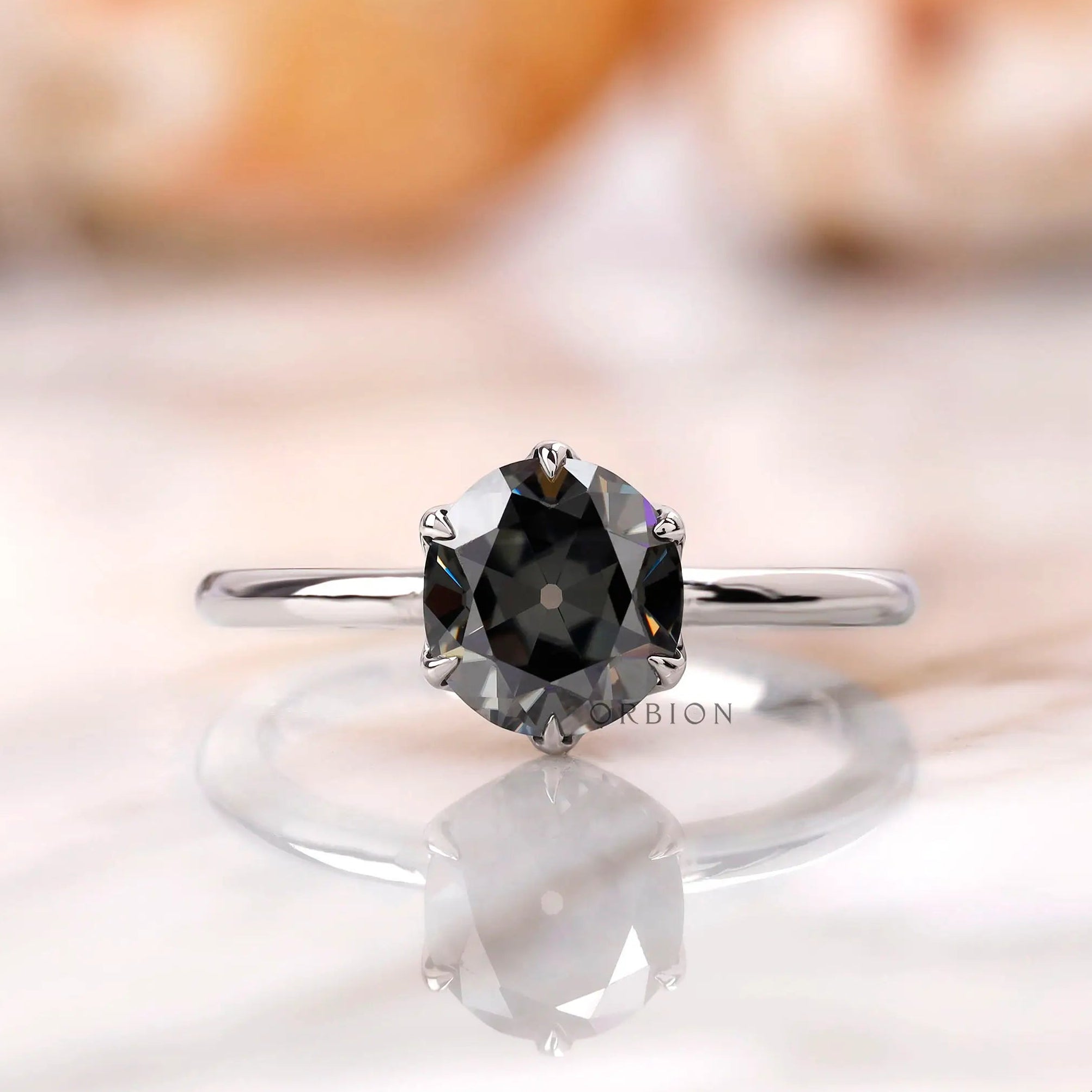 Front view of a grey Old European cut moissanite solitaire ring