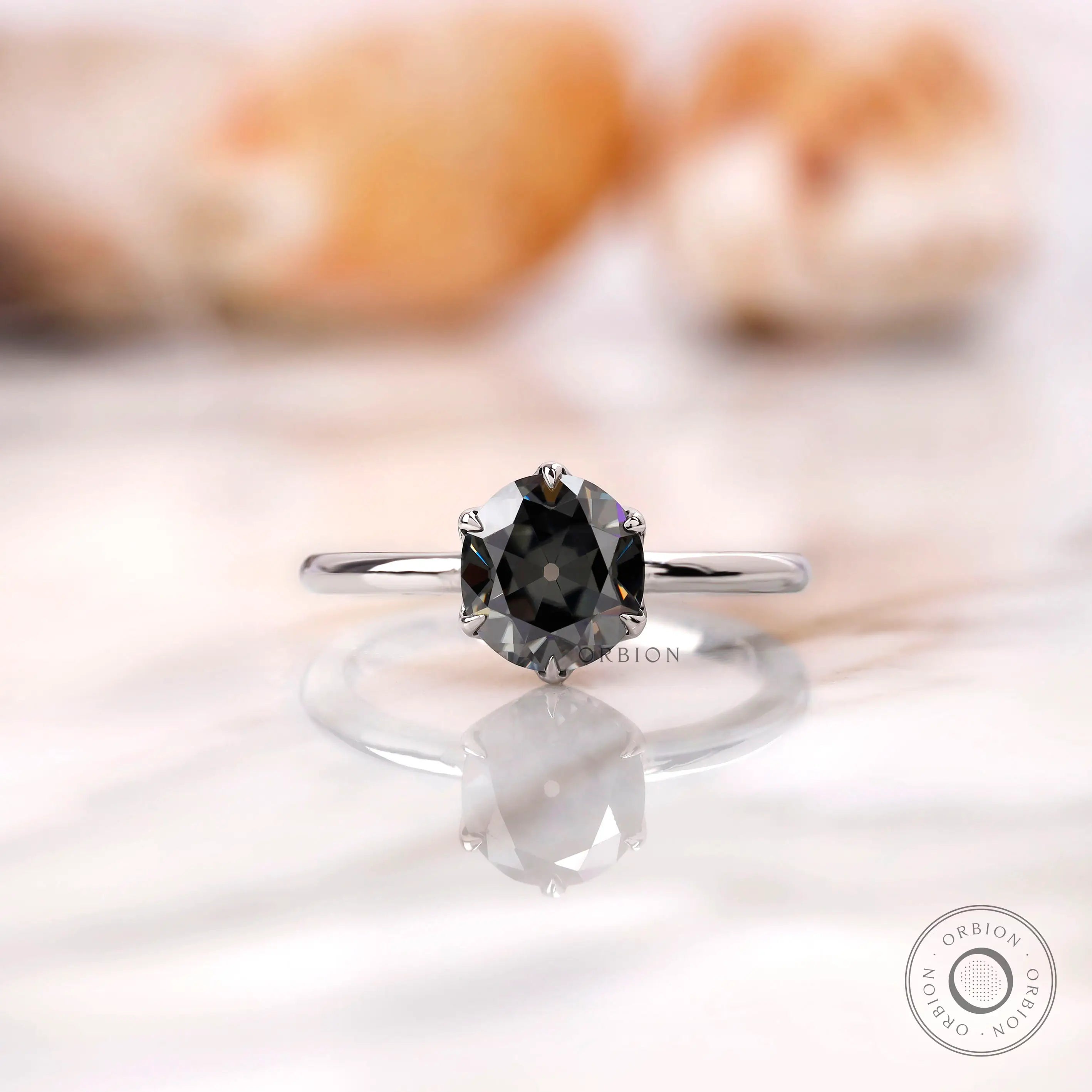 Front view of a grey Old European cut moissanite solitaire ring