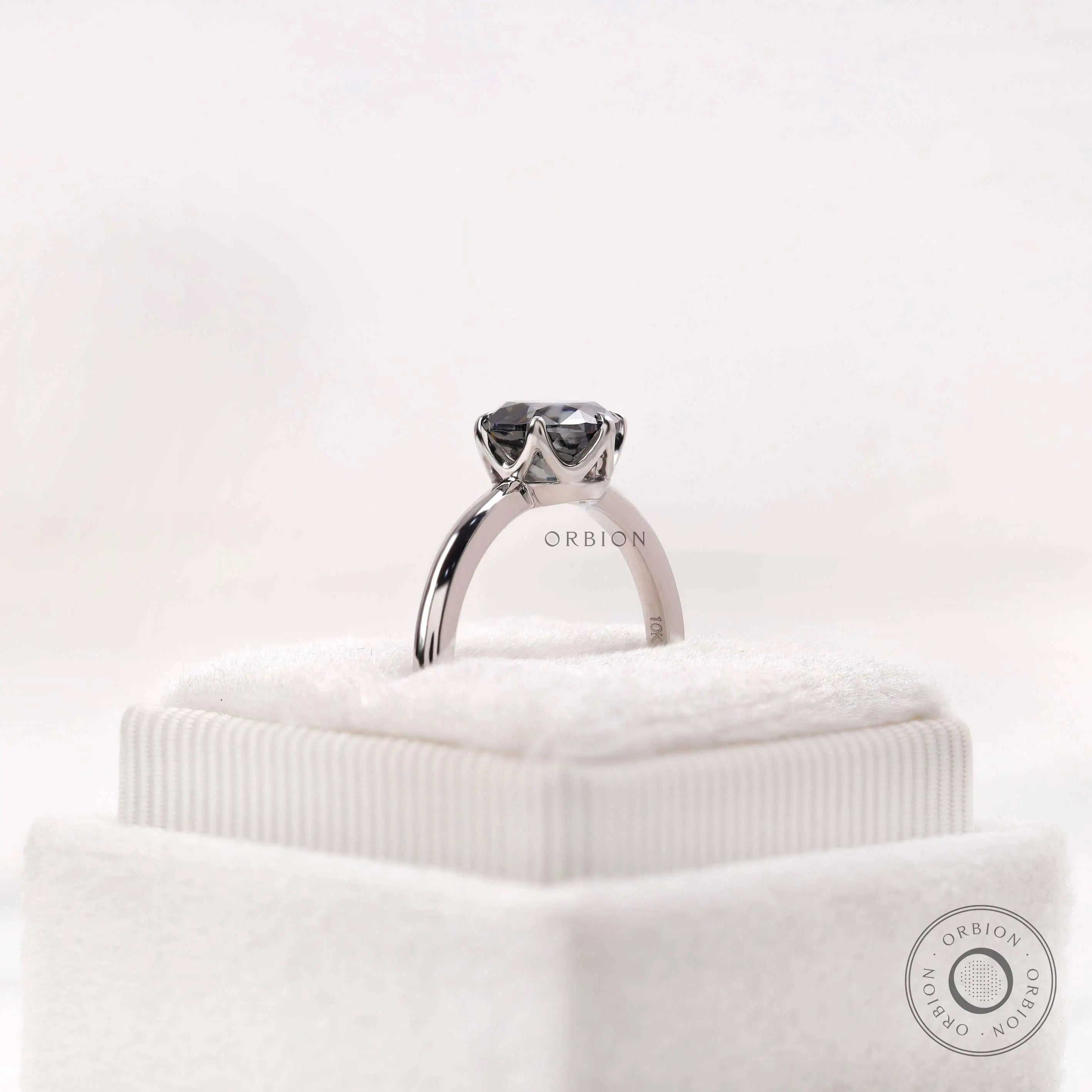 Stone height view emphasizing the Old European cut grey moissanite
