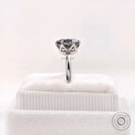 Detailed prong basket view of the grey moissanite solitaire in white gold