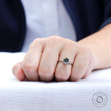Close up on hand view highlighting the brilliance of the grey moissanite