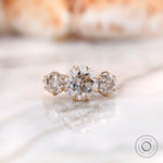 Round Old European cut three stone moissanite ring in 10K yellow gold front view
