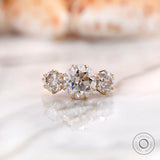 Round Old European cut three stone moissanite ring in 10K yellow gold front view