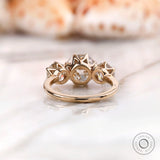 Old European cut moissanite three stone ring close up detail