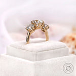 Three stone engagement ring profile view