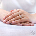 Vintage inspired round moissanite ring worn on hand