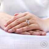 Vintage inspired round moissanite ring worn on hand