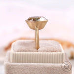 Bezel set oval ring shown straight side on