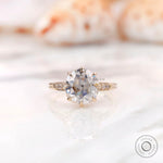 Front view showing round asymmetric Old European Cut moissanite