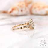 Side profile showing prong setting and accent stones