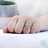 Hand shot displaying ring proportions and center stone size