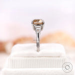Close-up rear view of an OMC cushion moissanite ring with baguette side stones