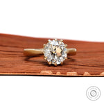 Old European cut moissanite ring angled wood top view