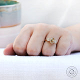 Old Mine Cut oval champagne moissanite shown close-up