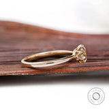 Side view of Champagne Moissanite solitaire ring showing delicate band