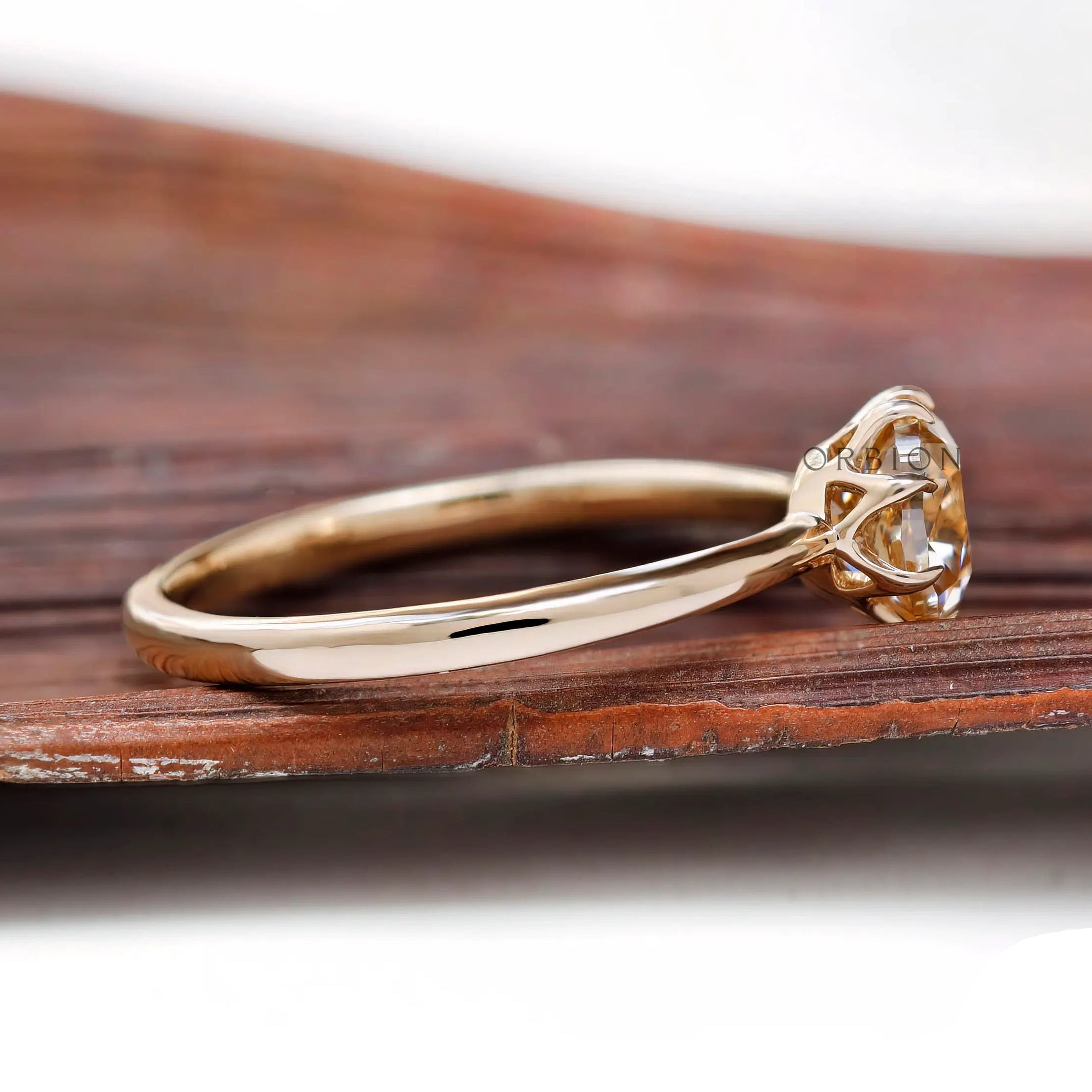 Side view of Champagne Moissanite solitaire ring showing delicate band